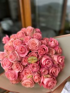 Luxury floral delivery service featuring Santa Monica's Pacific Park at sunset